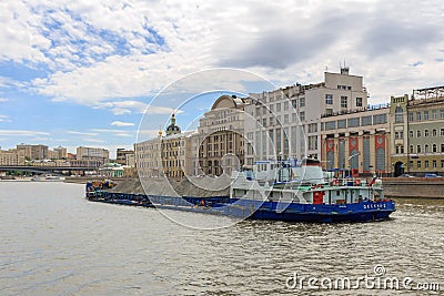 Moscow, Russia - June 21, 2018: Loaded barge floating on Moskva river in the center of Moscow on a sunny summer day Editorial Stock Photo