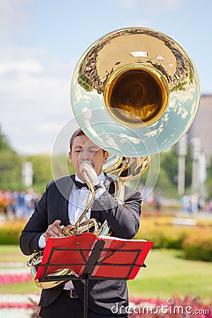 New Life Brass band, wind musical instrument player, orchestra performs music, man musician plays big sousaphone, trumpeter Editorial Stock Photo