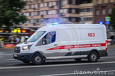 Moscow, Russia - June 16, 2019: White state ambulance minibus is moving along the wide and empty Moscow Avenue. Motion blur Editorial Stock Photo