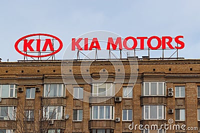 Moscow, Russia - March 25, 2018: Billboard with logo of korean car manufacturer KIA Motors on the building roof Editorial Stock Photo