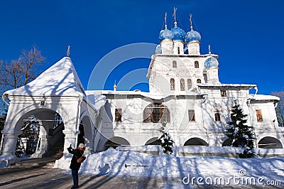 The Church of the Icon of Our Lady of Kazan in Kolomenskoye estate, tourist takes picture. Editorial Stock Photo