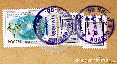 Postage stamp printed in Russia with stamp of Kovdor shows Quantum electronics foundations, N. Basov, A. Prokhorov, 1960s, Coat of Editorial Stock Photo