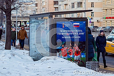MOSCOW, RUSSIA - MARCH 28, 2018: Public transport stop with advertising billboard of the FIFA 2018 World Cup mundial. Editorial Stock Photo