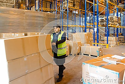 MOSCOW, RUSSIA - MARCH 18, 2021 Warehouse worker driving a forklift truck full of goods inside warehouse Editorial Stock Photo
