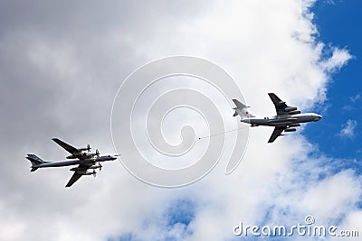 Moscow, Russia, May 7, 2021 - Air tanker Ilyushin IL-78 Midas and turboprop powered bomber Tu-95 Bear simulate in-flight Editorial Stock Photo