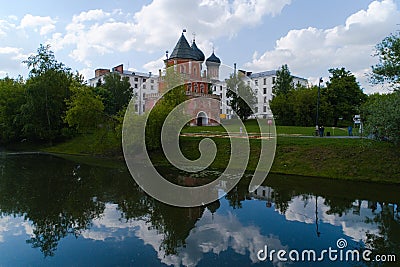 An ancient tower with reflection in a pond. Editorial Stock Photo