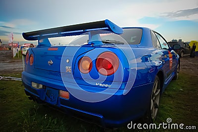 Moscow, Russia - May 25, 2019: The blue color Nissan skyline GTR R34 stands on the grass Editorial Stock Photo