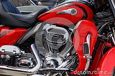 Moscow, Russia - May 04, 2019: Fragment of chrome engine with exhaust system pipes of Harley Davidson motorcycle. Moto festival Editorial Stock Photo