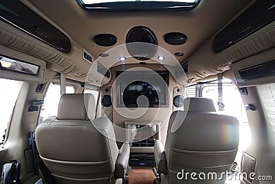 Moscow, Russia - May 2, 2019: GMC Savana/ Chevrolet Express tuning interior. Custom tuned interior with telephone, sound system Editorial Stock Photo