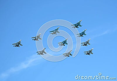 MOSCOW, RUSSIA - May 9, 2018: Group of Russian military supersonic high-altitude interceptors SU-34, SU-35, SU-30SM shows figure T Editorial Stock Photo