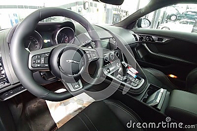 Moscow, Russia - May 1, 2019: Interior of Black Jaguar F-Type R on a lift at a Land Rover service center. Repair and diagnostics Editorial Stock Photo