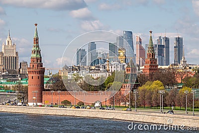 Moscow, Russia - May, 05, 2021: Kremlin Towers and Skyscrapers of Moscow City in spring. The contrast of Moscow architecture with Editorial Stock Photo