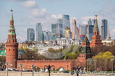 Moscow, Russia - May, 05, 2021: Kremlin Towers and Skyscrapers of Moscow City in spring. The contrast of Moscow architecture with Editorial Stock Photo