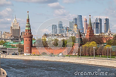 Moscow, Russia - May, 05, 2021: Kremlin Towers and Skyscrapers of Moscow City in spring. The contrast of Moscow architecture with Editorial Stock Photo