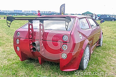 Moscow, Russia - May 25, 2019: Lada hatchback red color in exclusive tuning. Huge aerodynamic spoiler, custom exhaust system, body Editorial Stock Photo