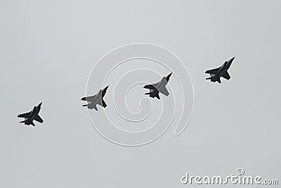 MiG-31K fighter interceptors fly in the sky over Red Square during an air parade dedicated to the 75th anniversary of Victory in t Stock Photo