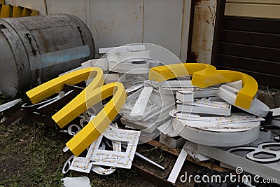 Moscow, Russia - 06.21.2022: McDonalds logo letter character M on dirty rubbish heap dump trash litter garbage. Fast Editorial Stock Photo