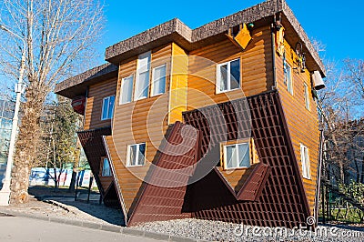 Moscow, Russia-November 06: An Upside-down house in VDNKh park,an upside-down car parked in the driveway on November 06,2015. Editorial Stock Photo