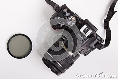 Moscow, Russia - 28 of October 2018: DSLR Photo camera Nikon d5600 with a photo filter on the white desk Editorial Stock Photo