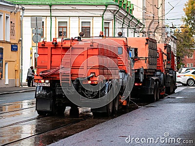 Moscow, Russia - October 19, 2019: Irrigation sweepers trucks stand on the tram tracks in front of the intersection in Editorial Stock Photo