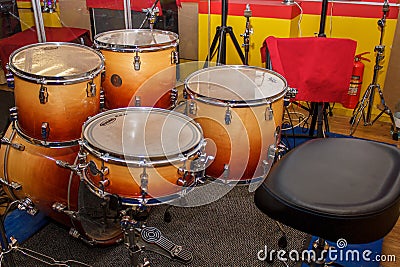 Moscow, Russia, 10 16 2017: Orange Evans Evans Drumheads Remo in the rehearsal room. Yellow and red drum in the room for musicians Editorial Stock Photo