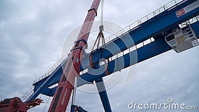 Moscow, Russia - September 2018: Gantry crane with hook for lifting. Clip. Construction site. Industrial plant. Editorial Stock Photo
