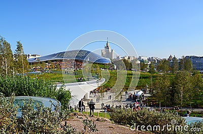 Moscow, Russia - September 23. 2017. People are walking in park Zaryadye against the background of glass bark. Editorial Stock Photo