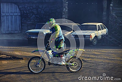 Moscow / Russia - September 23 2017: Pro motocross rider riding fmx motorbike, jumping performing extreme stunt. Professional Editorial Stock Photo