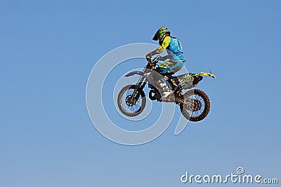 Moscow / Russia - September 23 2017: Pro motocross rider riding fmx motorbike, jumping performing extreme stunt. Professional Editorial Stock Photo