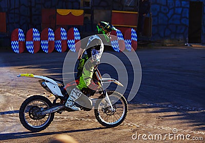 Moscow / Russia - September 23 2017: Pro motocross rider riding fmx motorbike, jumping performing extreme stunt. Professional Editorial Stock Photo