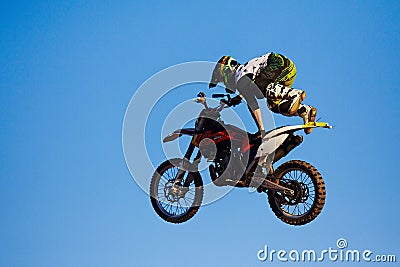 Moscow / Russia - September 23 2017: Pro motocross rider riding fmx motorbike, jumping performing extreme stunt. Professional Editorial Stock Photo