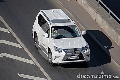 Moscow, Russia - September 27, 2022: White Japanese SUV Lexus LX driving down the road J200 Toyota Land Cruiser 200 LX570 500d Editorial Stock Photo