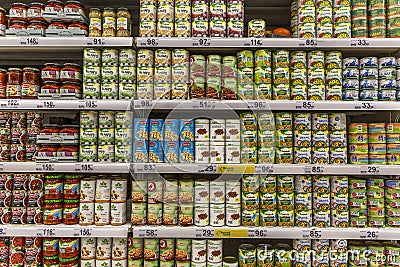 Moscow, Russia, 07/17/2020: Various cans of canned food on the shelves in the supermarket. Big choice Editorial Stock Photo