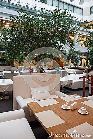 MOSCOW / RUSSIA - 15/06/2015 view of people having lunch in the open dining room of a restaurant in the atrium of the Smolensky Editorial Stock Photo