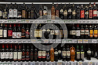 Moscow, Russia, 15/05/2020: Wine bottles on the shelves in the store. Large assortment of alcohol Editorial Stock Photo