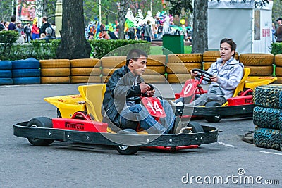 Young guys having fun in the park. Men karting close up. Editorial Stock Photo