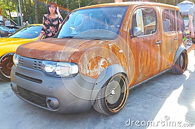 Moscow. Summer 2018. Nissan Cube tuned rat look style in rust. Stay on the street. wide wheels with fenders. Car tuned. Editorial Stock Photo