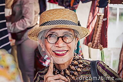 Moscow, summer Park-July 05, 2018: older woman from Indonesia wearing glasses and straw hat Editorial Stock Photo