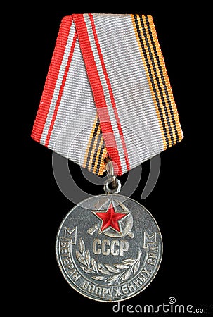 Moscow, USSR - CIRCA 1984: Soviet medal `Veteran of the Armed Forces of the USSR`, isolated on black background Editorial Stock Photo