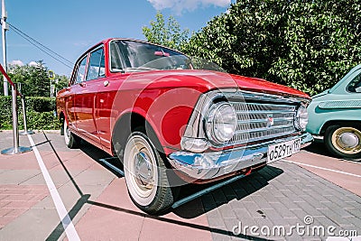 Moskvich-408 retro car in red colour, front side view. Moskvitch-408 is a small family car produced by the Soviet car Editorial Stock Photo