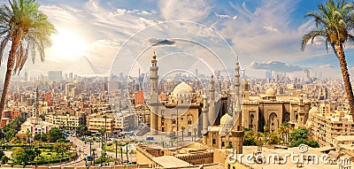 Mosque-Madrasa of Sultan Hassan behind the palm trees, Cairo, Egypt Stock Photo