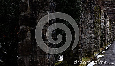 A mossy stonetunel with a gloomy ambience Stock Photo