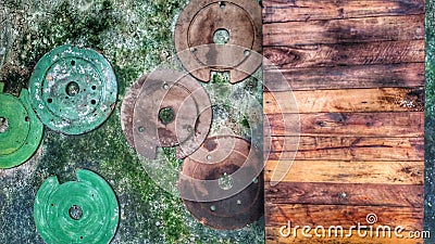 Mossy walls adorned with iron plates and wooden boards Stock Photo