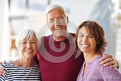 The most important women in my life. Portrait of a senior man standing beside his wife and daughter. Stock Photo