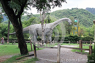 The most scary and huge dinosaur sculpture placed in jungle park photograph Editorial Stock Photo