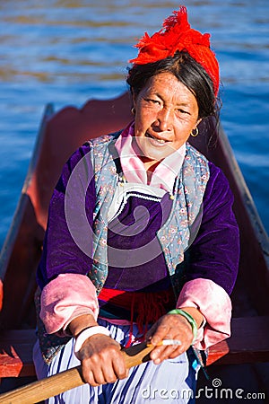 The Mosuo senior woman boating Editorial Stock Photo