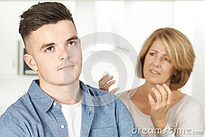 Mother Arguing With Teenage Son Stock Photo