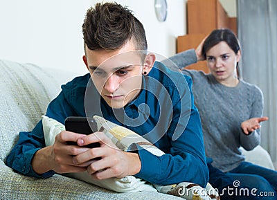 Mother asking for attention of teenager Stock Photo