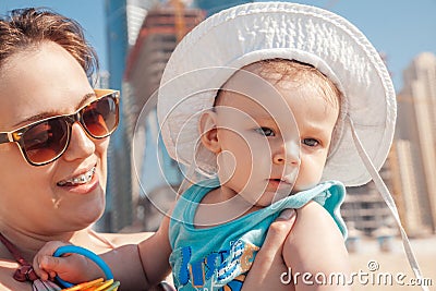 Mother And Baby Boy At The JBR Beach Stock Photo