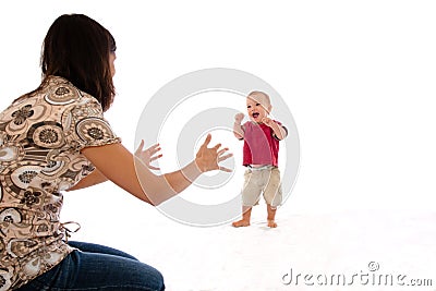 Mother and baby first walking steps Stock Photo